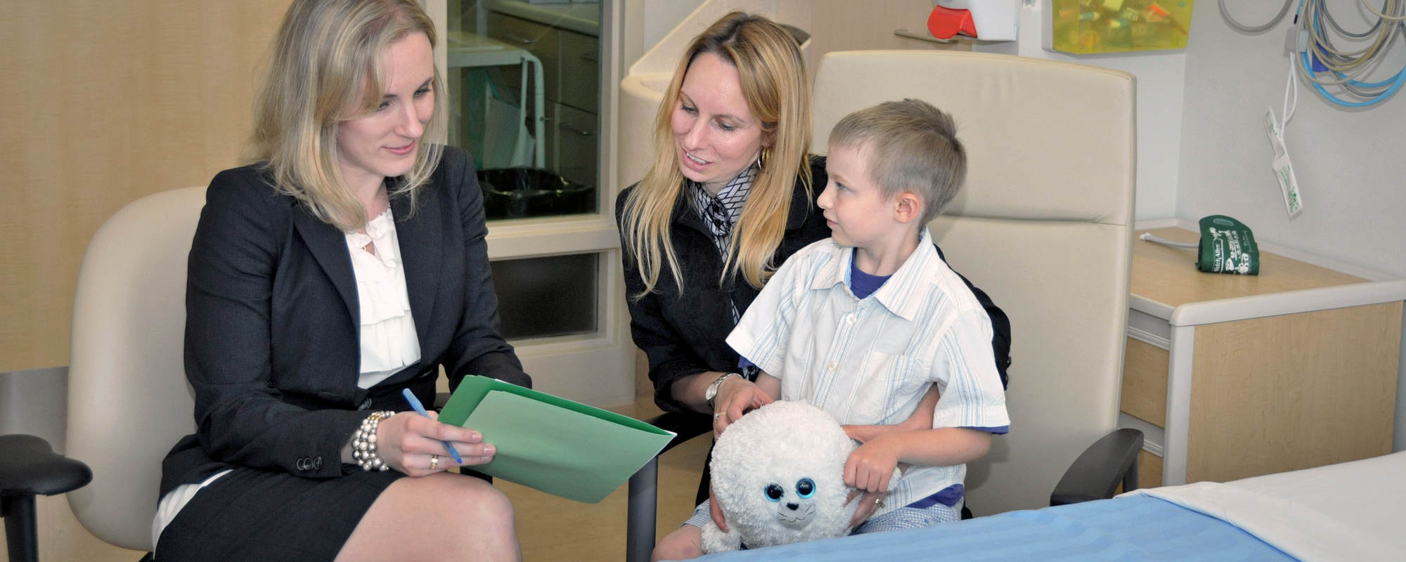 Children's Hospital London, Ontario. Legal aid. Mother, son and a lawyer. A photo.